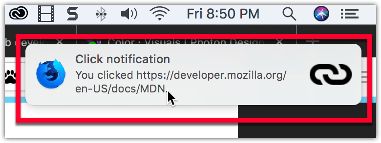 Example notification on macOS, located below the system clock, with a bold title reading "Click notification" followed by regular text reading "You clicked https://developer.mozilla.org/en-US/docs/MDN". The notification has the Firefox Nightly logo on the left side, and a link icon on the right.